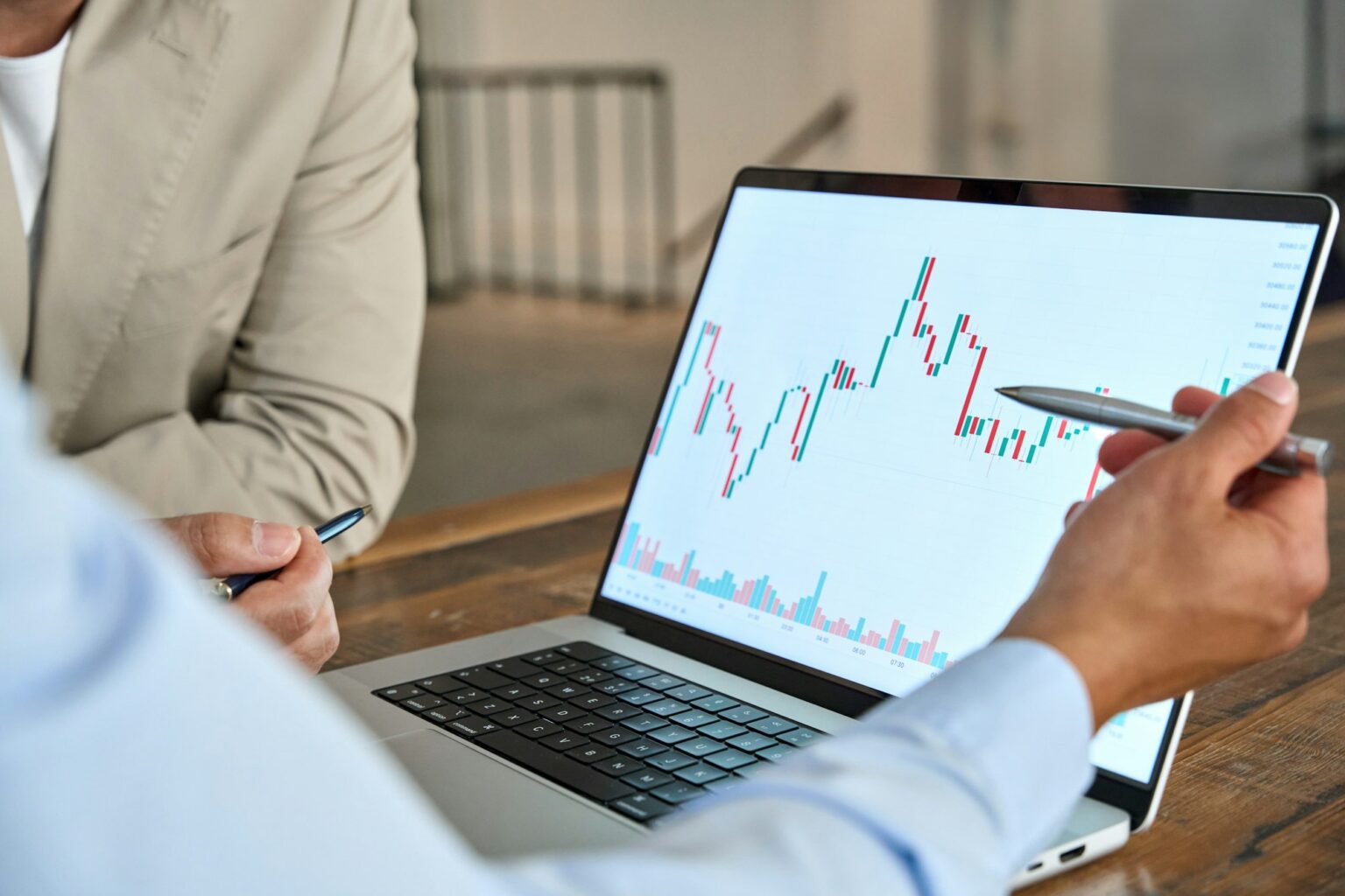 Financial investor explaining invest stock market data pointing on laptop.